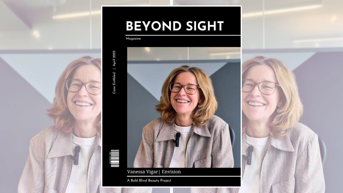 The Beyond Sight Magazine header photo (a still from her video) features Vanessa Vigar, a white female in her fifties, with medium-length auburn/reddish hair, seated at a desk against a modern, minimalist backdrop with angular shapes and subtle color contrasts. She wears a light-colored top with a checkered jacket, which has a soft texture. The background has muted tones, enhancing the overall sophistication. The text on the cover includes the magazine's tagline, 'A Bold Blind Beauty Project,' and identifies the issue as April 2025.